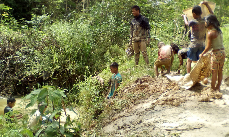 gathering clay to build an oven