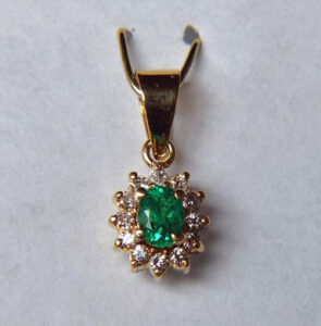 A fine example of a gold and diamond pendant